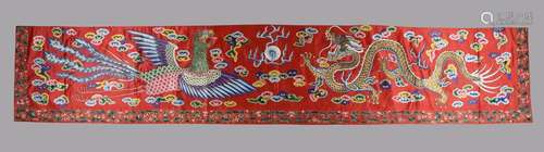 A fine Chinese red silk five coloured cloud pattern horizont...