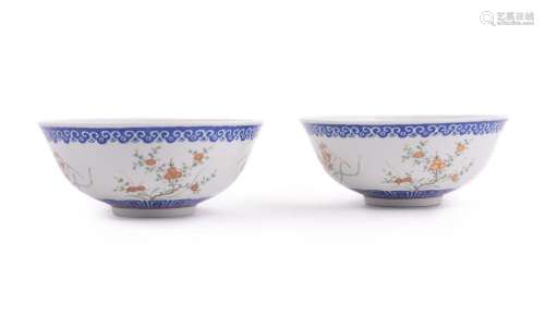 A pair of Chinese Famille Rose and blue enamelled bowls