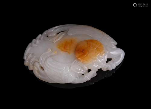 A Chinese white and russet jade plaque of winged mythical fi...