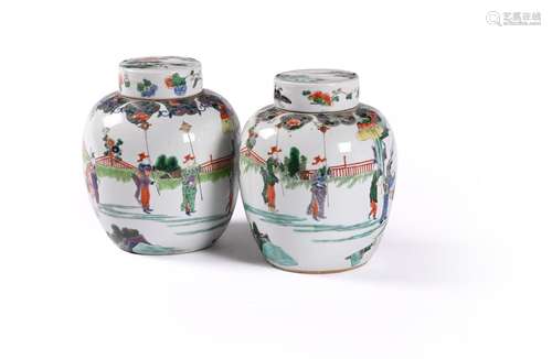 A pair of Chinese famille verte jars and covers