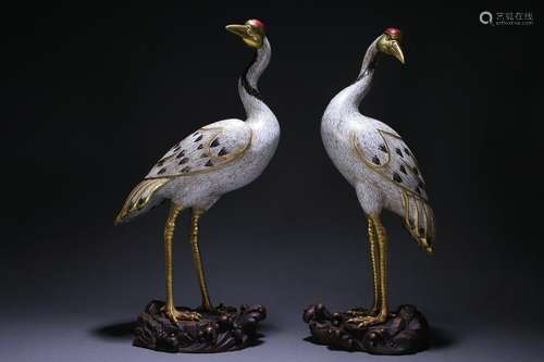 A pair of old Tibetan bronze cloisonné crane ornaments