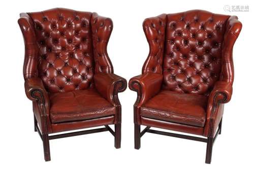 PAIR OF HIDE UPHOLSTERED WINGBACK ARMCHAIRS