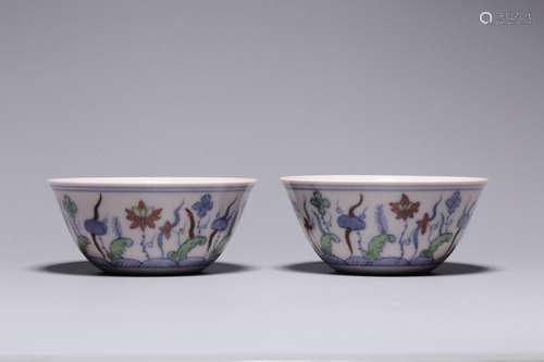 A pair of cups with lotus pattern