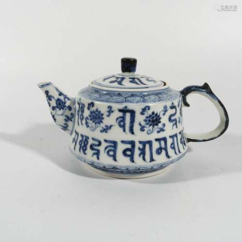 blue and white sanskrit pot