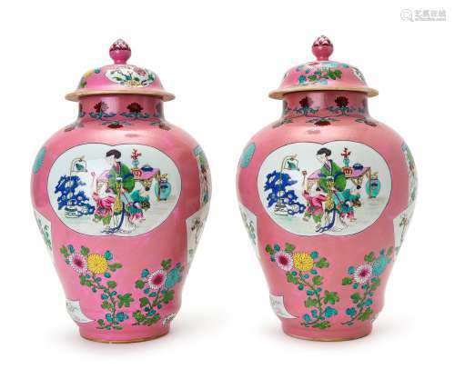 A PAIR OF CHINESE PINK GROUND FIGURAL BALUSTER LIDDED VASES,...