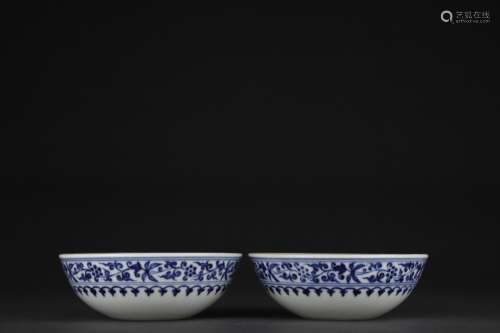 A pair of blue and white floral lying foot bowls