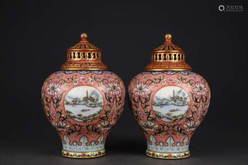 A pair of pastel landscape vases with red glaze and open win...