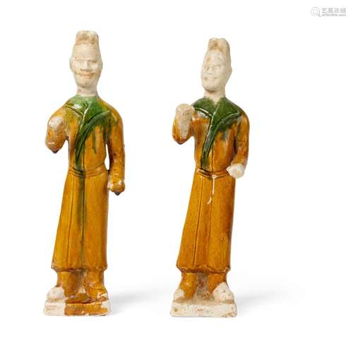 TWO SANCAI-GLAZED POTTERY FIGURES OF GROOMS TANG DYNASTY