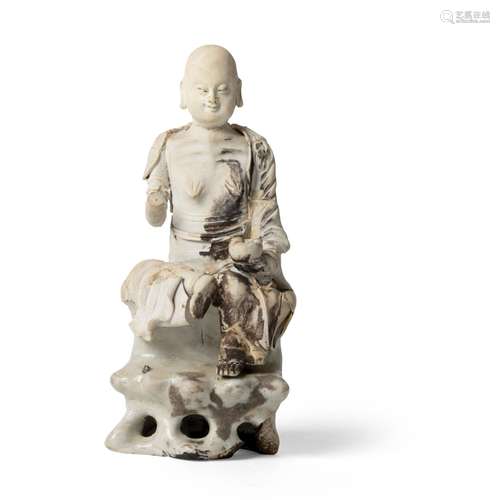 CARVED PORCELAIN FIGURE OF A SEATED LUOHAN SOUTHERN SONG DYN...