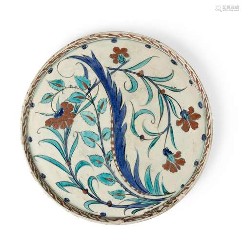 IZNIK-STYLE RIMLESS POTTERY DISH WITH SAZ LEAF 19TH CENTURY