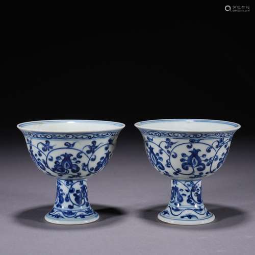 A pair of blue and white stem-cup