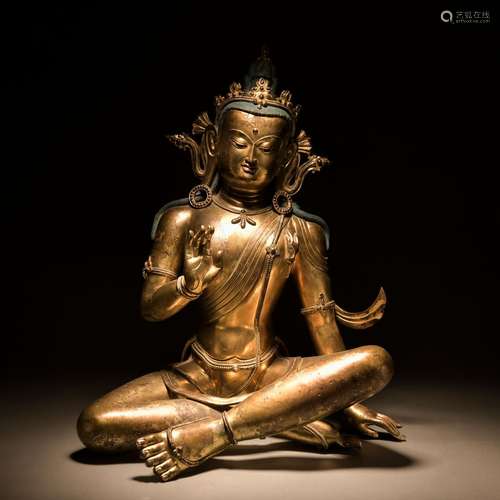 A gilt-bronze statue of buddha