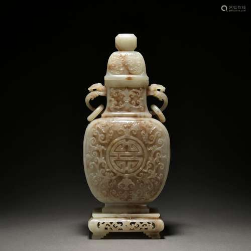 A jade vase and cover