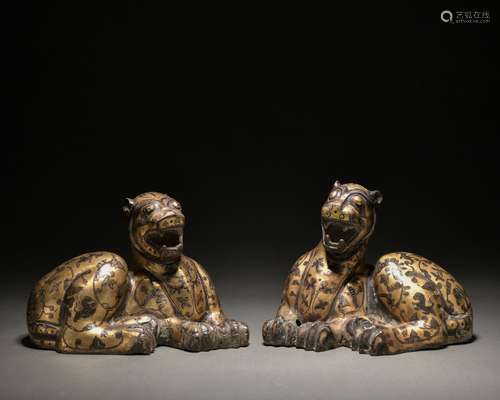 A pair of bronze beast ware with gold