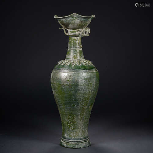 Before the Ming Dynasty, a green glaze and silver phoenix he...