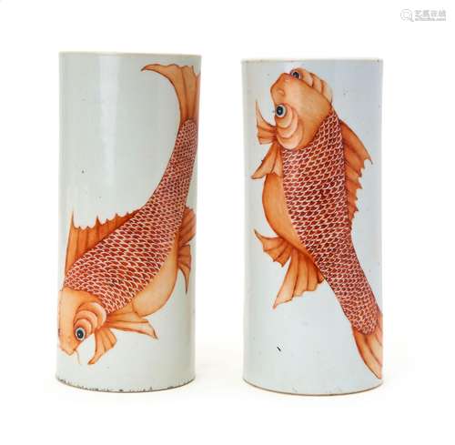 A PAIR OF CHINESE IRON RED "CARP FISH" HAT STANDS,...