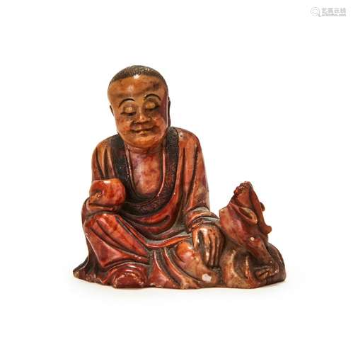 A CHINESE SOAPSTONE FIGURE OF A BUDDHA, 18TH CENTURY, QING D...