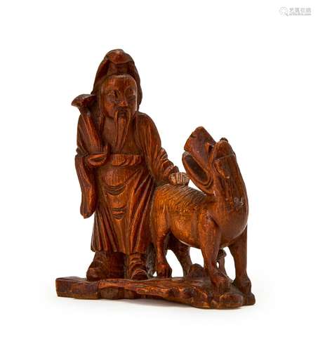 A CHINESE BAMBOO FIGURE OF A LUOHAN AND A MYTHICAL BEAST, 18...