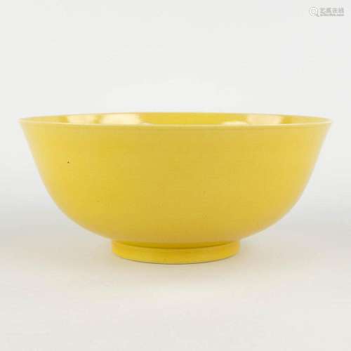 A Chinese bowl with monochrome yellow glaze, Tonghzi mark an...