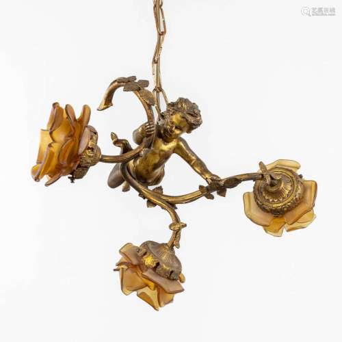 A chandelier with a putto and three glass shades, gilt bronz...