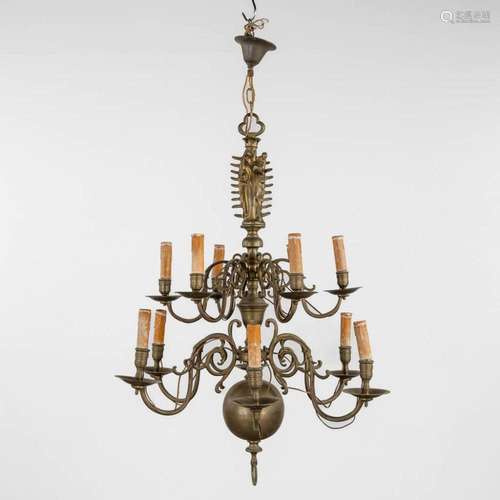 A double flemish chandelier with an image of Madonna with Ch...