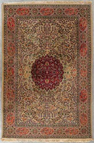 An Oriental hand-made carpet with fauna and flora, Iran. (D:...