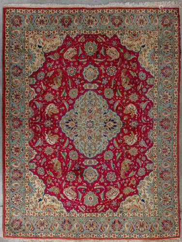 An Oriental hand-made carpet, decor of mythological figurine...