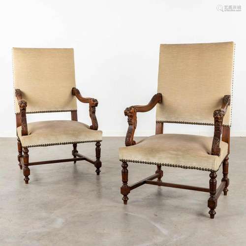 A pair of armchairs with sculptured lion handles. 19th C. (D...