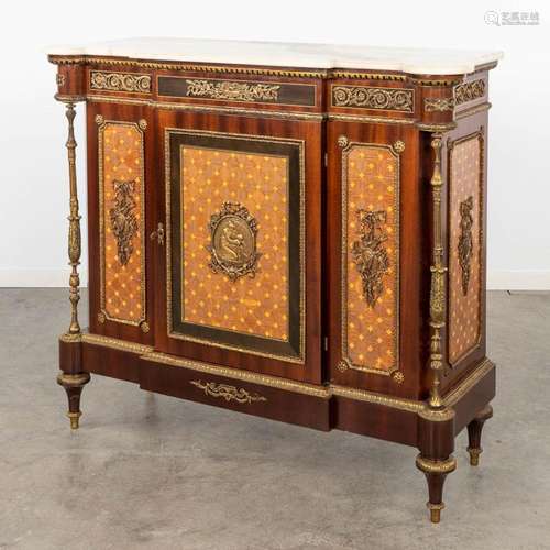 A cabinet, wood veneer mounted with bronze in Louis XVI styl...