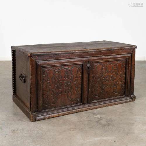 An antique chest with wrought iron hardware, probably Portug...