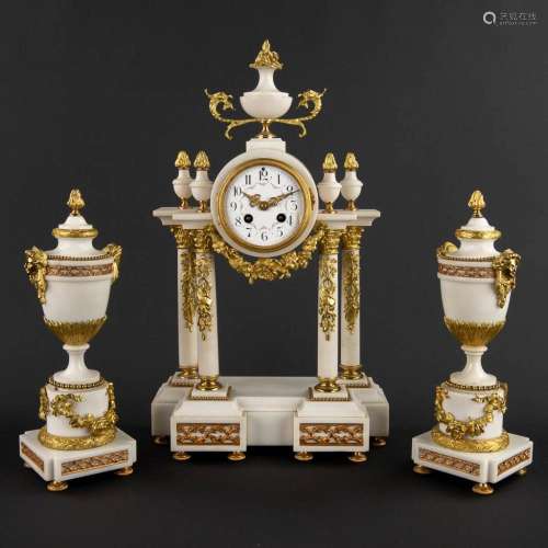 A three-piece mantle garniture clock and side pieces, marble...