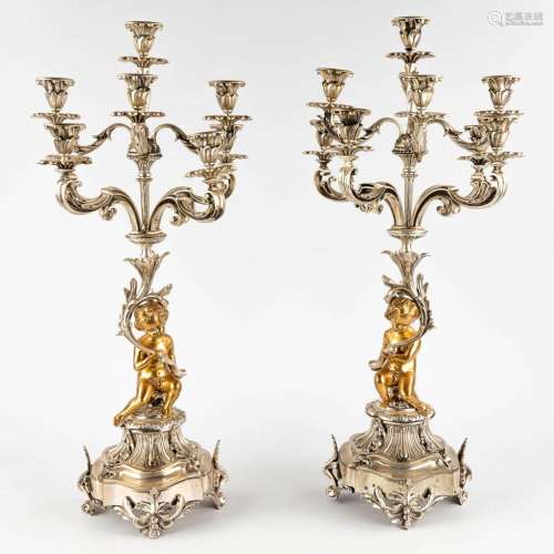 A pair of candelabra with putti, silver- and gold plated bro...