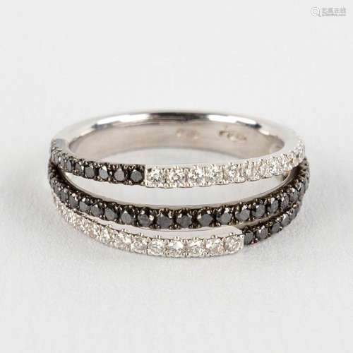 A ring, 18kt white gold with black and white diamonds, appr....