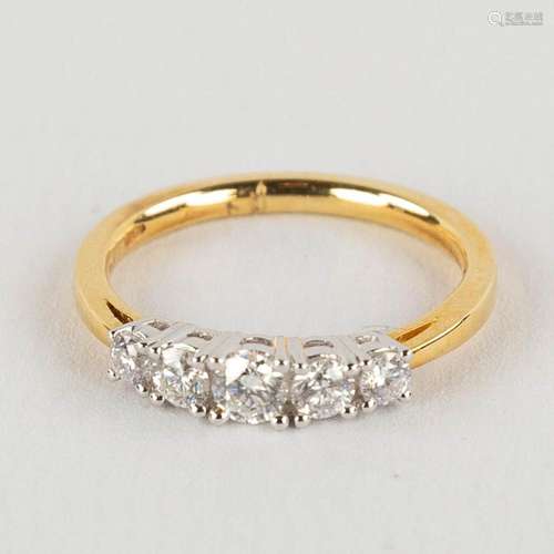 A ring, 18kt yellow and white gold with 5 diamonds, appr. 0,...