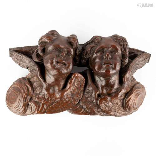 A wood-sculptured wall console with angels, 18th C. (D:14 x ...