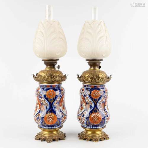 A pair of Japanese Imari and brass mounted oil lamps, 19th C...