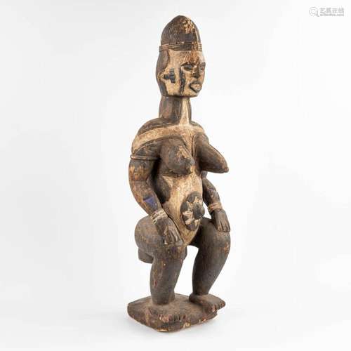 A decorative wood sculptured 'Maternity Statue' Idom...