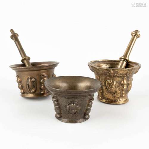 Three antique mortars with two pestles, bronze. Probably Spa...