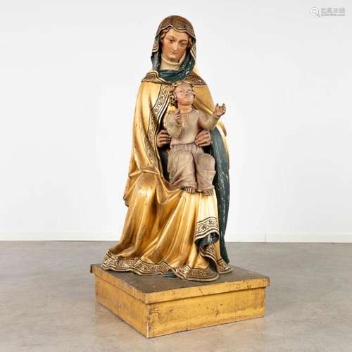 An antique wood-sculptured statue of Saint Anna with child, ...