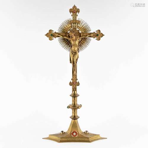 A crucifix, richly decorated with cabochons, enamel and bron...