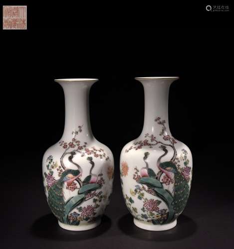 A pair of famille rose vases with peacock flower patterns