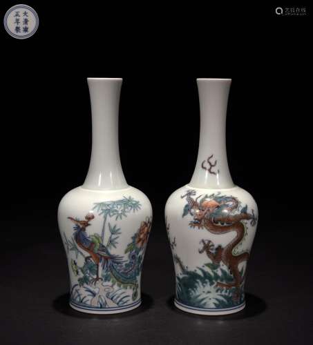 A pair of famille rose vases with dragon and phoenix pattern...