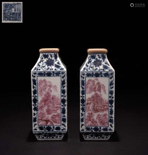 A pair of alum-red landscape vases with blue and white botto...