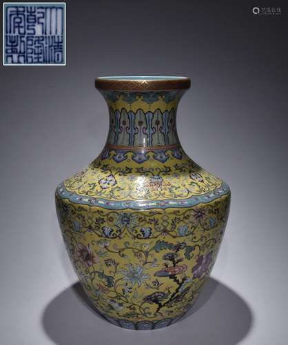 Yellow-backed famille rose vase with floral patterns