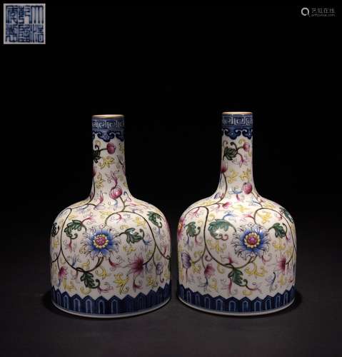 A pair of famille rose vases with twisted branches and flora...