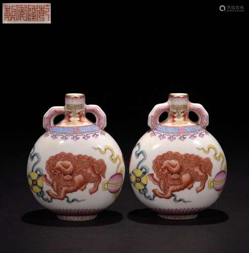 A pair of flat vases with pastel painted gold lion and hydra...