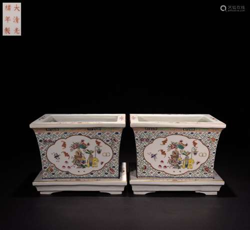 A pair of flower pots with famille rose and golden window op...