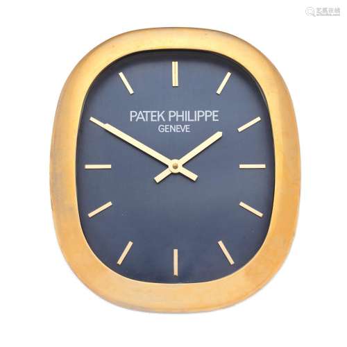 Patek Philippe by Inducta. A gilt metal quartz wall clock  E...