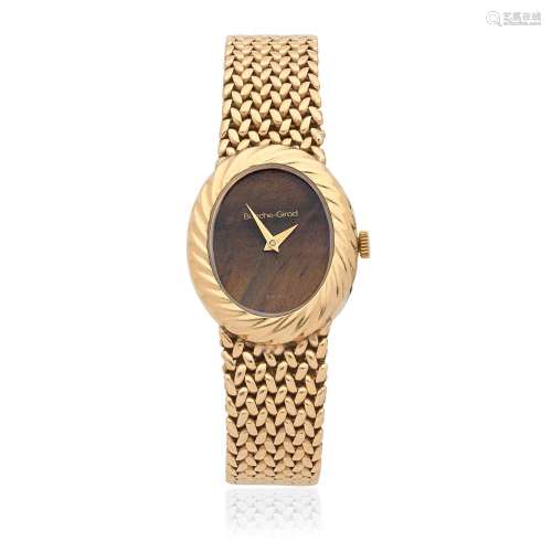 Bueche-Girod. A 9K gold quartz bracelet watch with tiger's e...