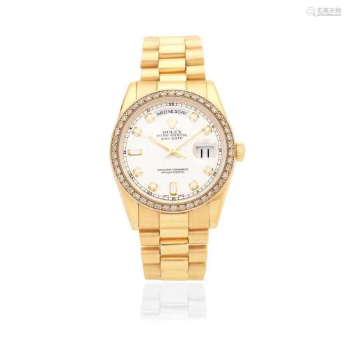 Rolex. An 18K gold diamond set automatic calendar bracelet w...